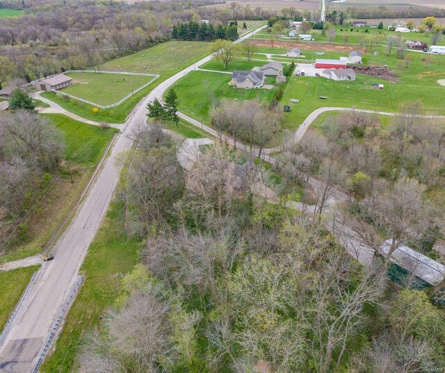 birds eye view of property with a rural view