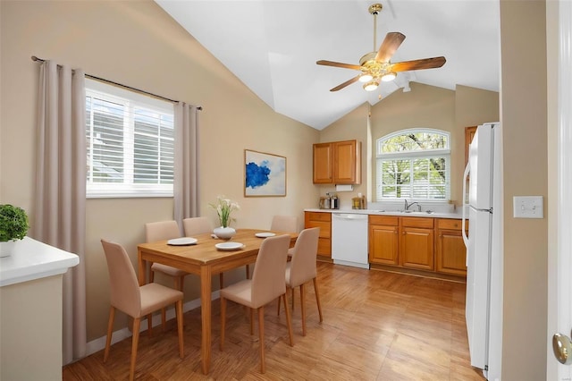 dining area with ceiling fan and lofted ceiling