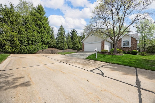 view of front facade featuring concrete driveway, brick siding, a front lawn, and a garage