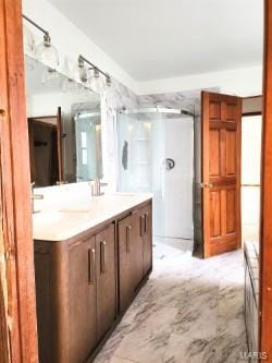 bathroom with radiator, double vanity, and a sink