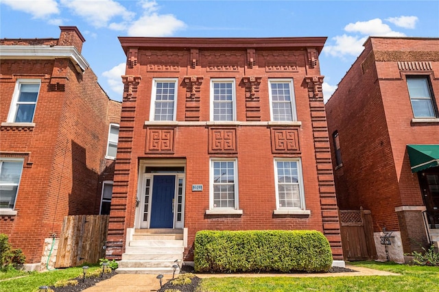 view of front of home featuring brick siding and entry steps