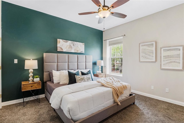 carpeted bedroom with ceiling fan and baseboards