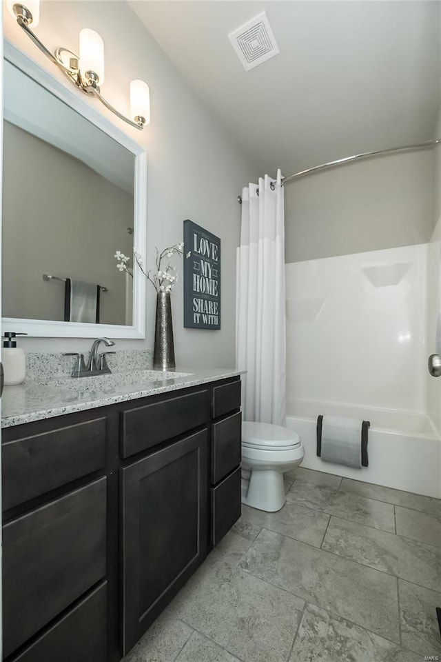 bathroom featuring visible vents, toilet, vanity, and shower / bath combination with curtain