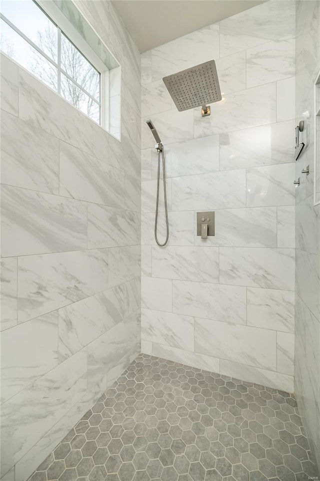 bathroom with a tile shower