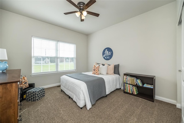 bedroom featuring ceiling fan, carpet flooring, and baseboards