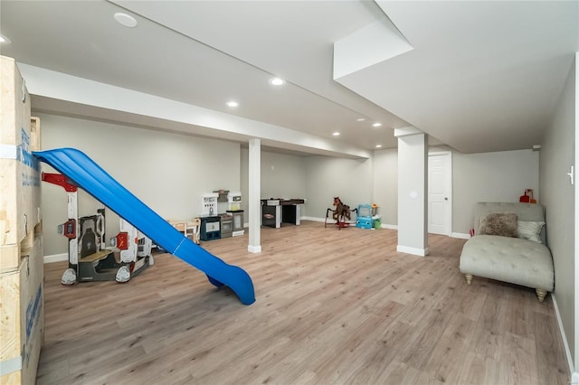interior space featuring recessed lighting, light wood-style floors, and baseboards