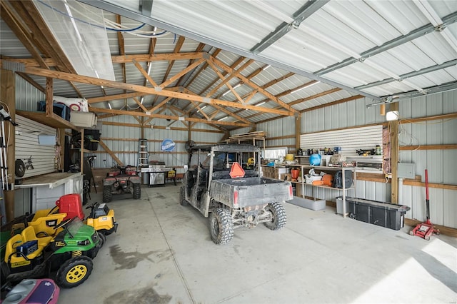 garage with metal wall and a workshop area