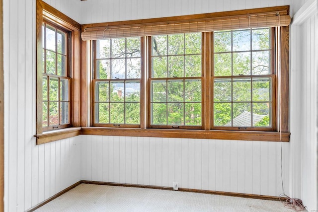 unfurnished sunroom with a healthy amount of sunlight