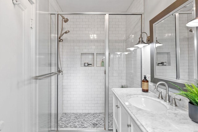 full bathroom featuring vanity and a stall shower