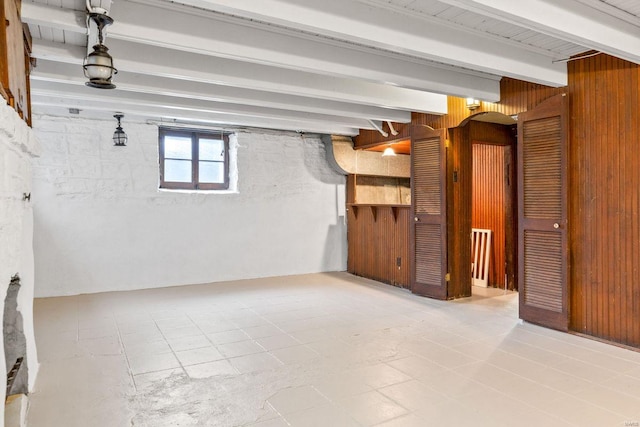 below grade area featuring wooden walls