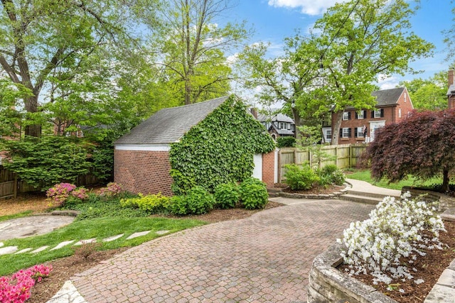 exterior space featuring an outbuilding and a fenced backyard