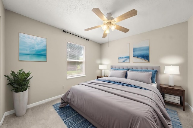 bedroom featuring carpet floors, baseboards, and ceiling fan