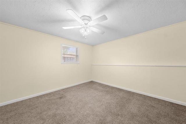 empty room with baseboards, a textured ceiling, carpet, and ceiling fan