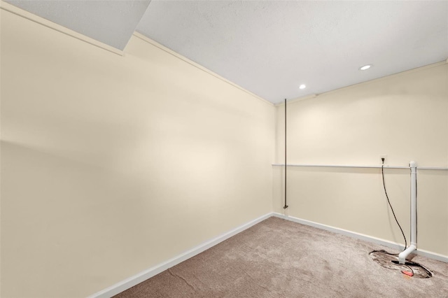 carpeted spare room with recessed lighting and baseboards