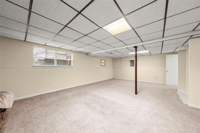 basement featuring baseboards and carpet