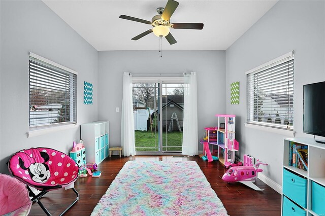recreation room featuring a ceiling fan, baseboards, and wood finished floors
