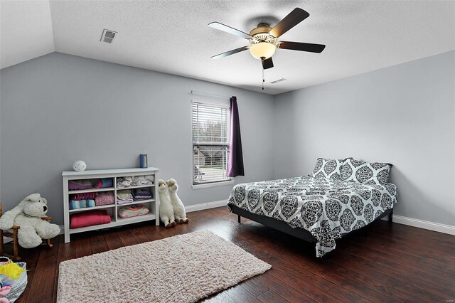 bedroom featuring hardwood / wood-style floors, baseboards, and visible vents