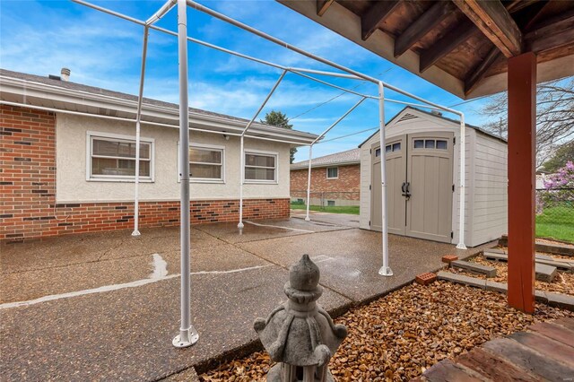 view of yard with a patio, a storage shed, and an outbuilding