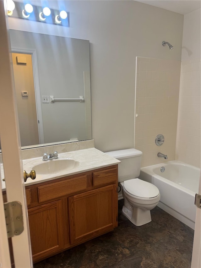 bathroom with toilet, vanity, and shower / tub combination