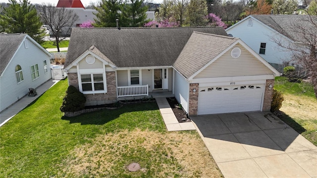 view of front facade featuring a garage, concrete driveway, a front yard, brick siding, and covered porch