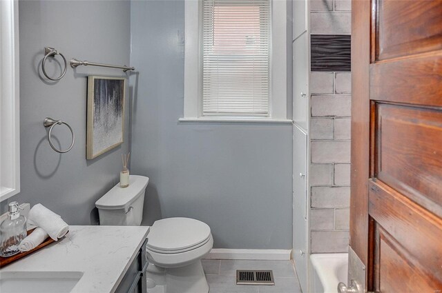 full bathroom featuring visible vents, baseboards, toilet, vanity, and tile patterned flooring