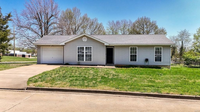 ranch-style house featuring a front lawn, a garage, and driveway