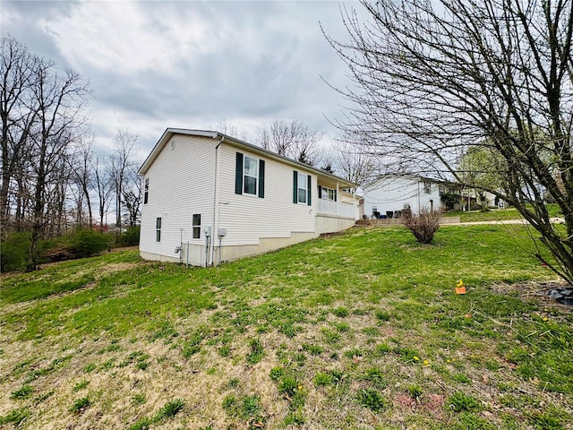 view of property exterior featuring a yard