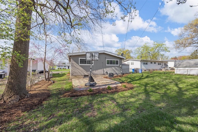 back of property with a yard and cooling unit