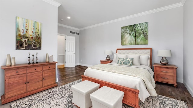 bedroom featuring baseboards, visible vents, crown molding, and wood finished floors
