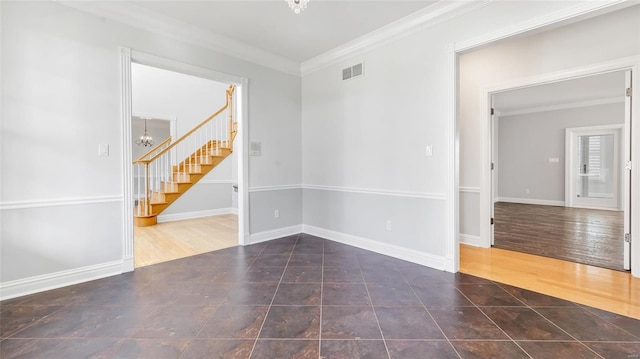 empty room with stairs, ornamental molding, visible vents, a notable chandelier, and wood finished floors