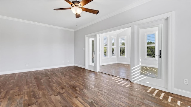 unfurnished room with baseboards, crown molding, wood finished floors, and a ceiling fan