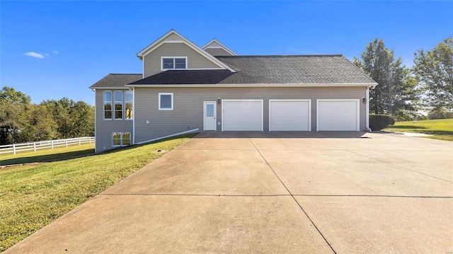 view of property exterior with a lawn, fence, a garage, and concrete driveway