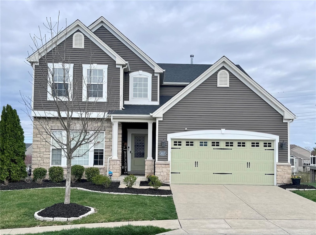 craftsman-style home featuring an attached garage, driveway, stone siding, and a front lawn