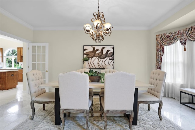 dining area featuring crown molding and a notable chandelier