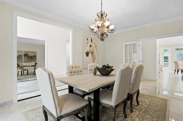 dining space featuring a chandelier, ornamental molding, marble finish floor, and baseboards