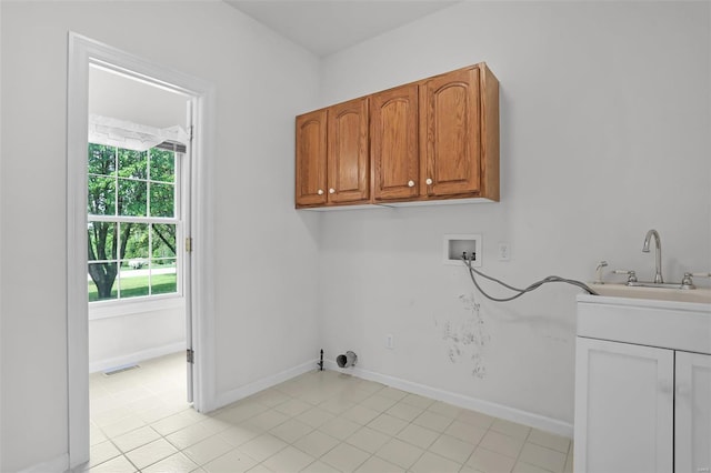 washroom with hookup for a gas dryer, a sink, visible vents, hookup for a washing machine, and cabinet space