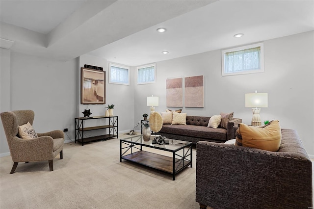 living room featuring a healthy amount of sunlight, recessed lighting, and light carpet