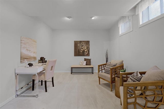 office space with light colored carpet and baseboards