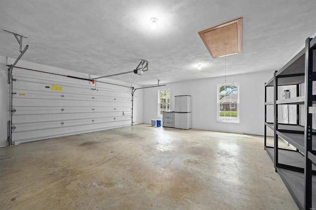 garage featuring a garage door opener