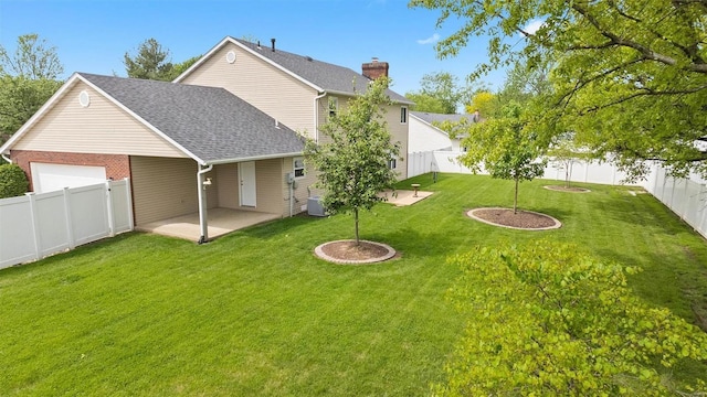 view of yard with a fenced backyard, a patio, and cooling unit