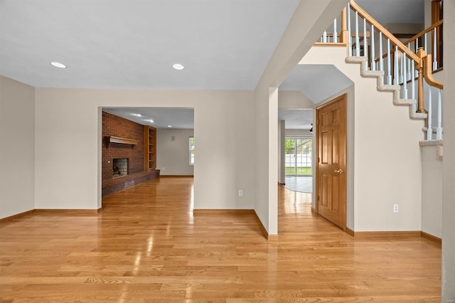 entryway featuring stairs, recessed lighting, baseboards, and light wood-style floors