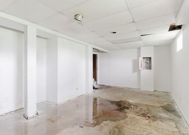 below grade area with a paneled ceiling