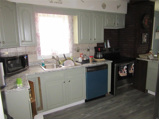 kitchen featuring decorative backsplash, white cabinets, stainless steel electric range oven, dishwasher, and a sink