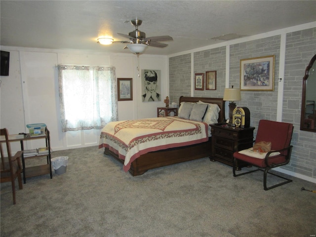 bedroom with a textured ceiling and carpet