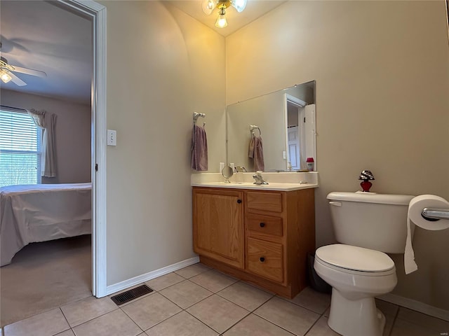 bathroom featuring toilet, baseboards, visible vents, a ceiling fan, and tile patterned flooring