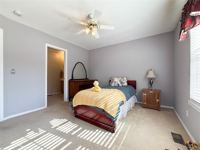 bedroom with light colored carpet, multiple windows, and visible vents