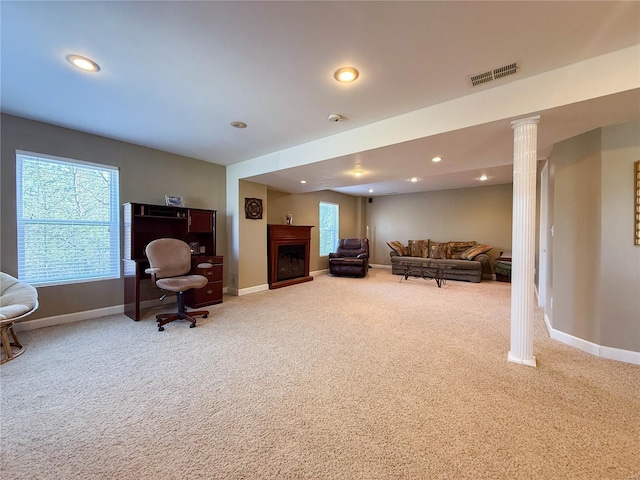 living room with baseboards, a fireplace, visible vents, and carpet floors