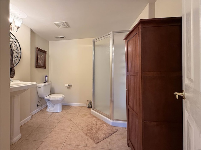 full bath featuring a shower stall, visible vents, and tile patterned floors