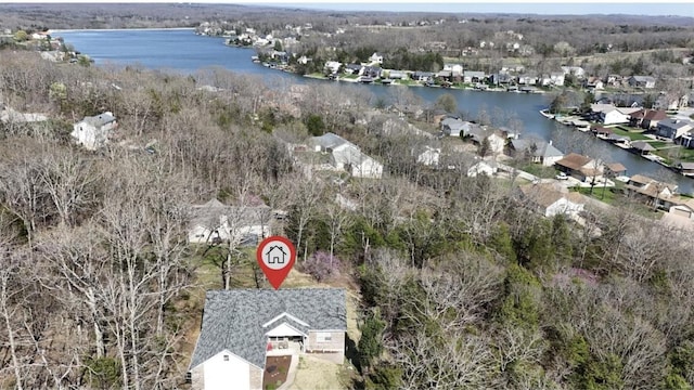 birds eye view of property with a residential view and a water view