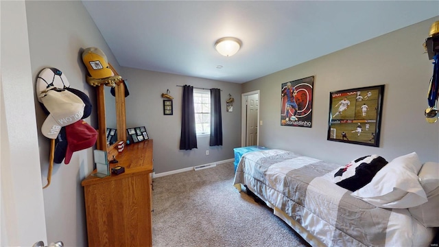 bedroom featuring baseboards, carpet, and visible vents